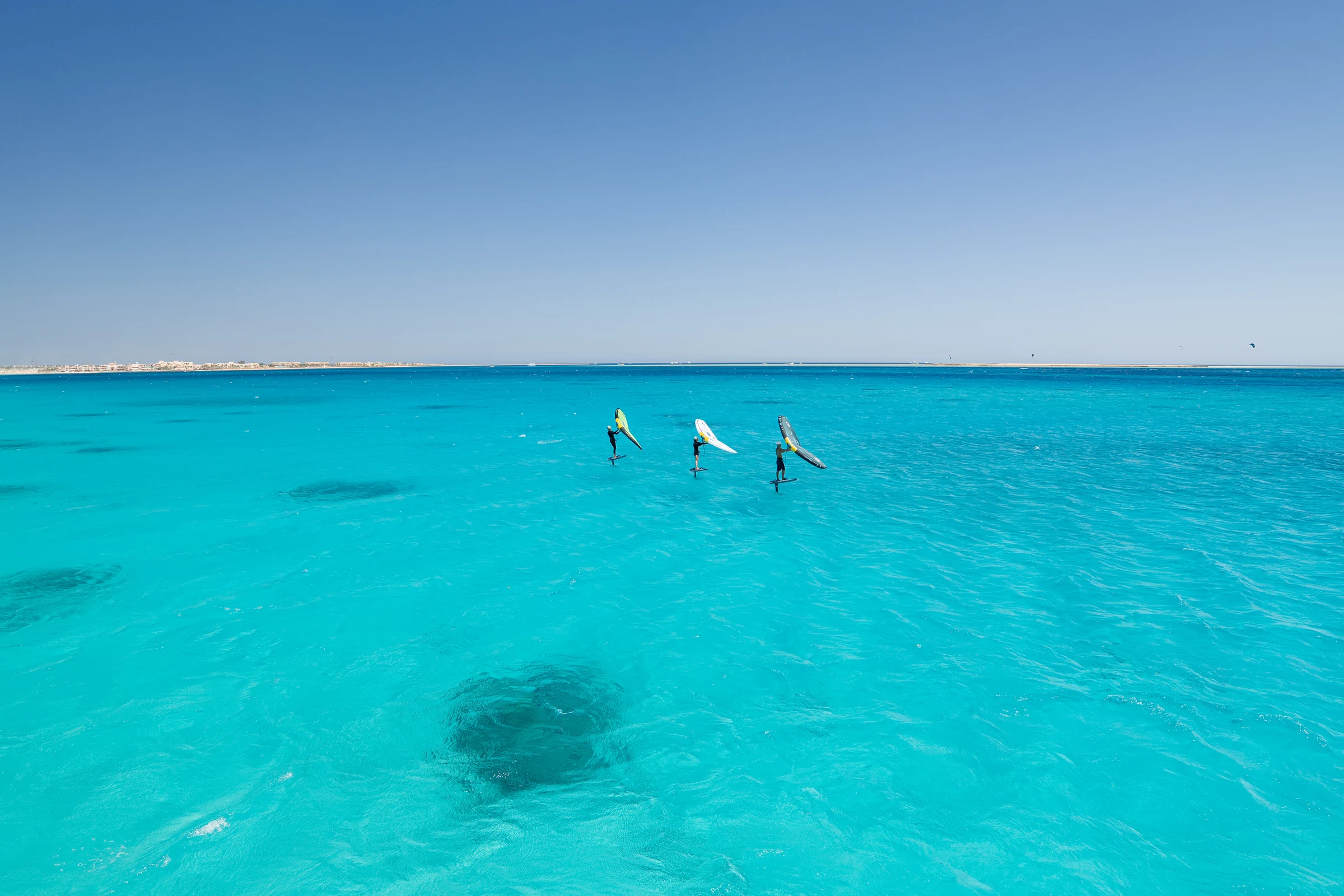 Foiling above turquoise water