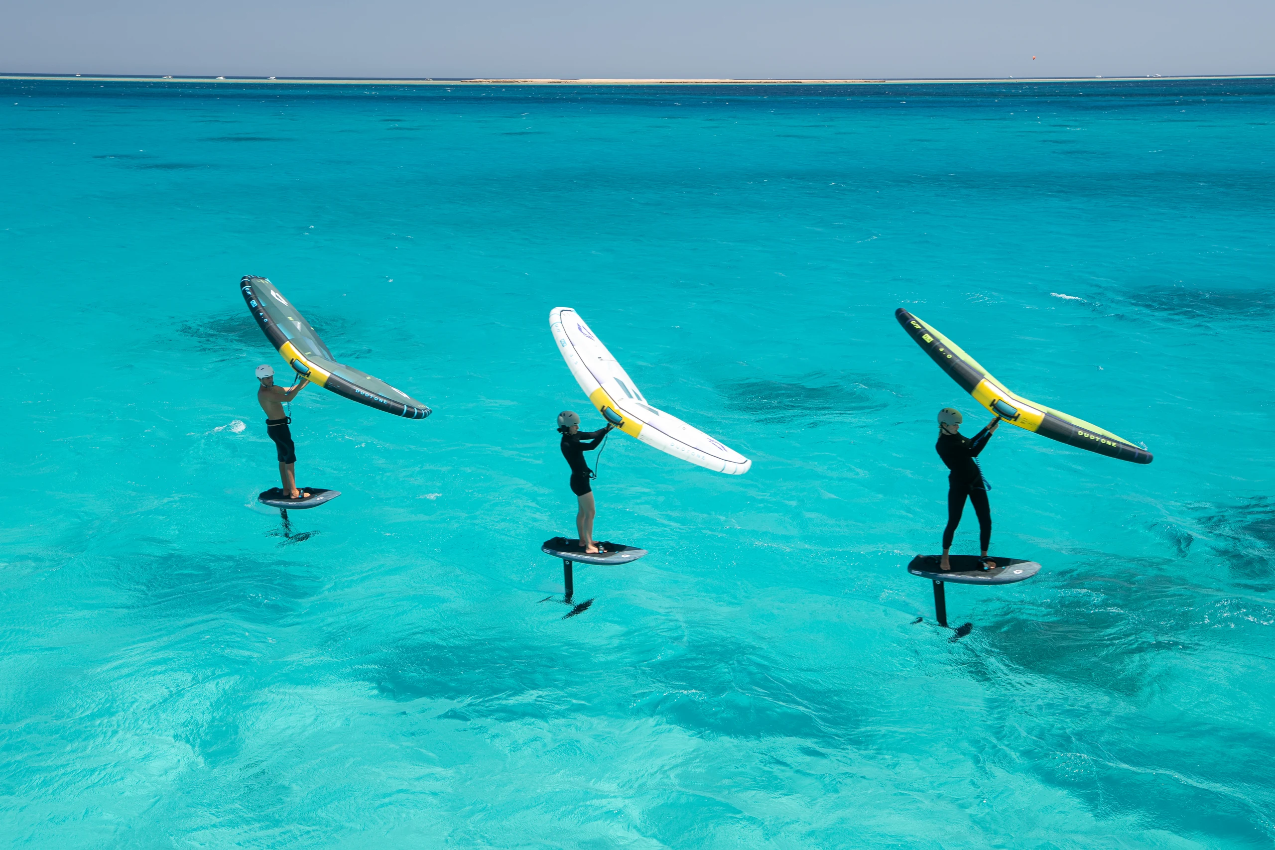 Wingfoiler with a wing in clear Red Sea water
