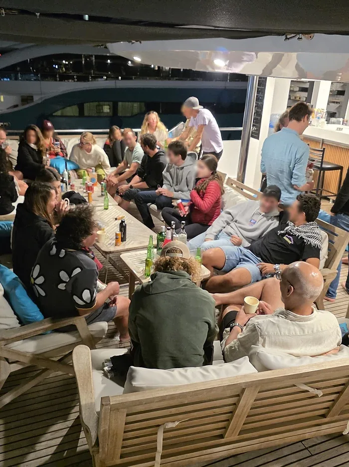 Guests sharing an evening together on the yacht